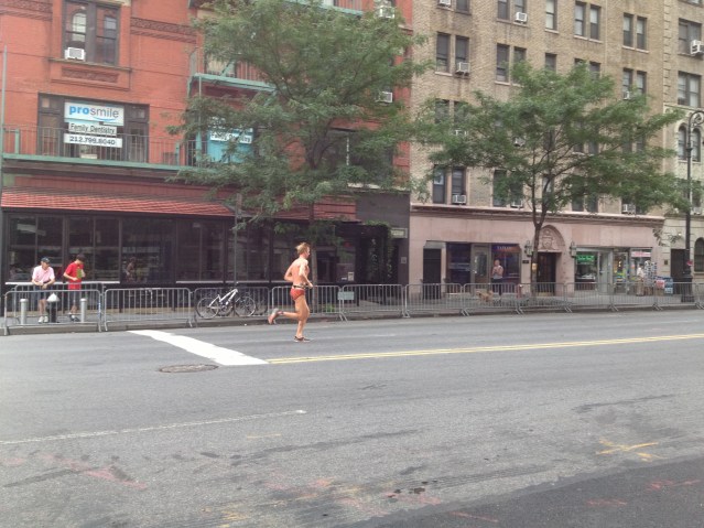 Dude running in a speedo.